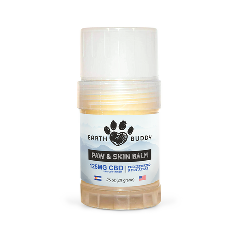 A tube of Earth Buddy hemp 125 mg Paw & Skin Balm for dogs on a wooden table. Perfect for dry skin & noses.