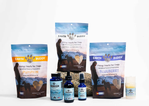 Full spectrum CBD oil and hemp products for dogs from Earth Buddy on a white surface