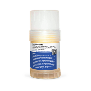 A tube of Earth Buddy hemp 125 mg Paw & Skin Balm for dogs on a wooden table. Perfect for dry skin & noses.
