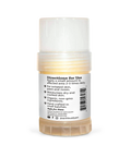 A tube of Earth Buddy hemp 125 mg Paw & Skin Balm for dogs on a wooden table. Perfect for dry skin & noses.
