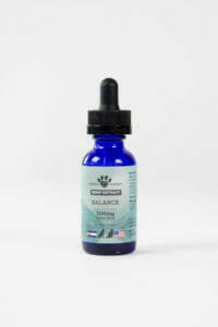 Earth Buddy Balance CBDa tincture for dogs and cats in a blue glass bottle with dropper.